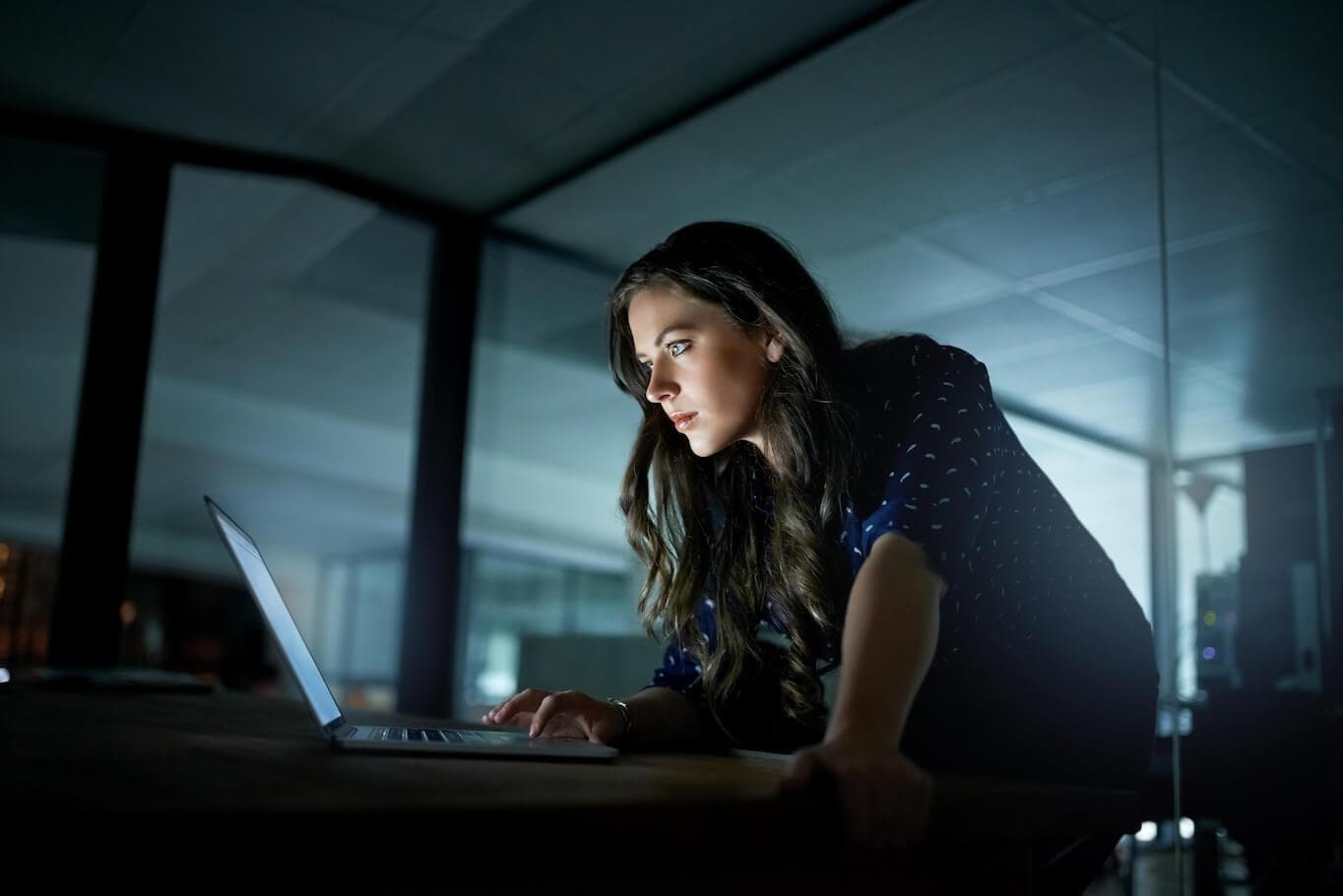 Woman behind laptop evening